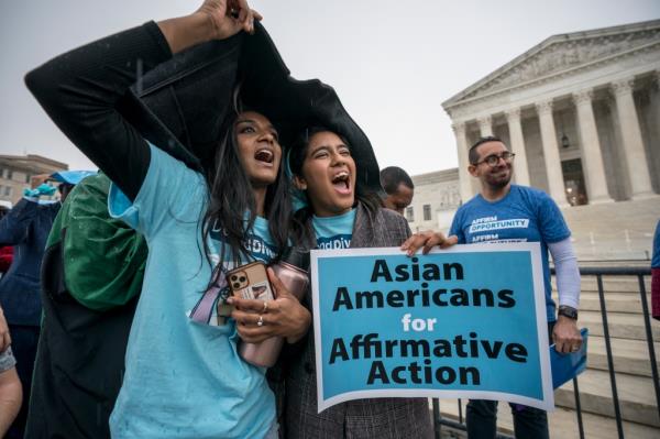 Harvard students Shruthi Kumar, left, and Muskaan Arshad, join a rally with other activists as the Supreme Court hears oral arguments on a pair of cases that could decide the future of affirmative action in college admissions, in Washington, Monday, Oct. 31, 2022