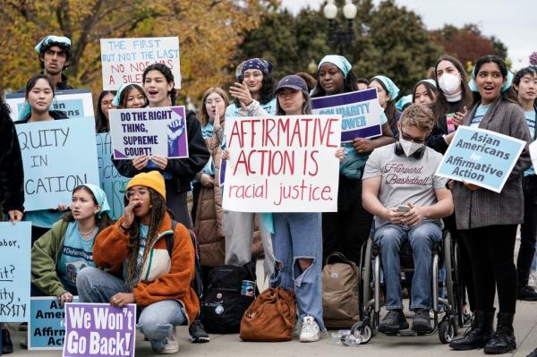 Activists demo<em></em>nstrate as the Supreme Court hears oral arguments on a pair of cases that could decide the future of affirmative action in college admissions, in Washington, Oct. 31, 2022