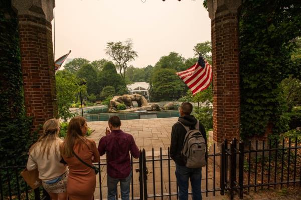 People try to visit the Central Park Zoo as smoke from Canadian wildfires casts a haze over the area on June 7, 2023.