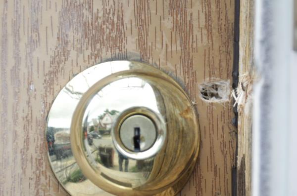 Bullet hole left in the front door.