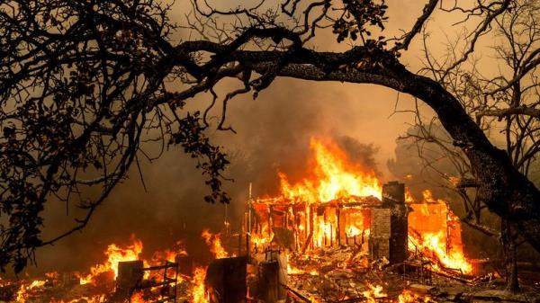 Flames co<em></em>nsume a structure on Bessie Lane as the Thompson Fire burns in Oroville, Calif., July 2, 2024. (AP Photo/Noah Berger)