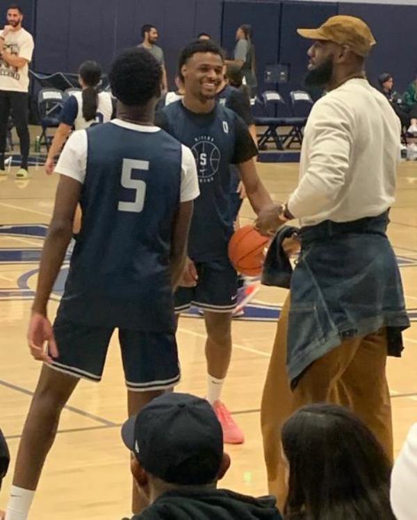 LeBron James with his sons sons Bro<em></em>nny and Bryce at the Midnight Madness basketball event at Sierra Canyon in Chatsworth, Ca.