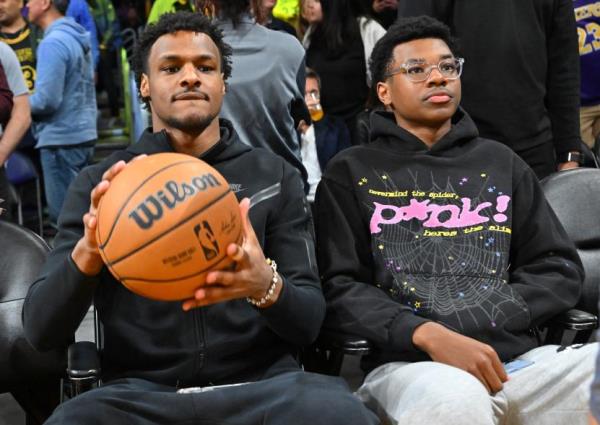 Bro<em></em>nny and Bryce James attend a Lakers game against the Milwaukee Bucks at Crypto.com Arena.