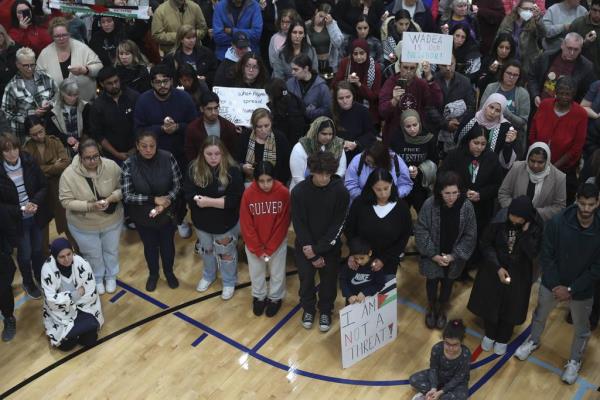 Mourners pray during a community vigil for Wadea al-Fayoume at the Prairie Activity and Recreation Center in Plainfield on Oct. 17, 2023. 