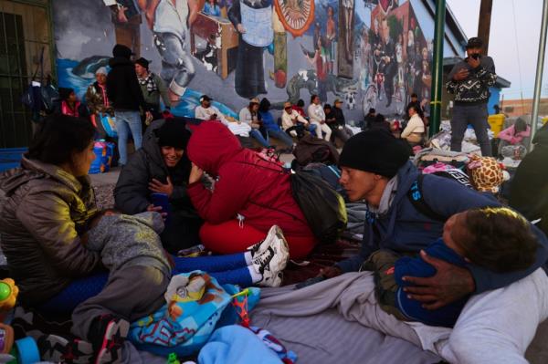 Migrants gather at a church shelter in El Paso, Texas, on Sunday.