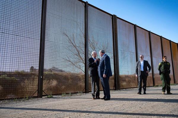 President Biden reviews a section of the border wall on Sunday near El Paso, Texas.