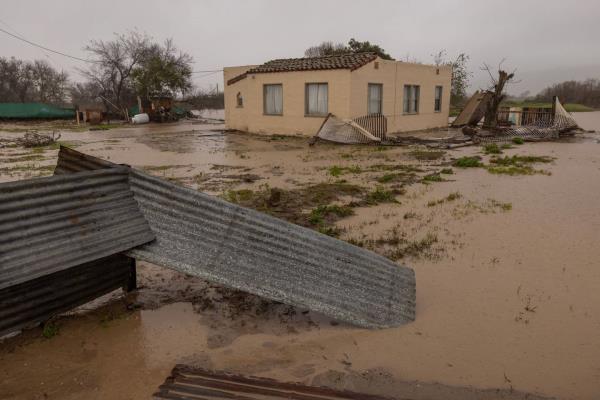 Flood waters inundate a home by the Salinas River near Chualar, California, on January 14, 2023, as a series of atmospheric river storms co<em></em>ntinue to cause widespread destruction across the state. 