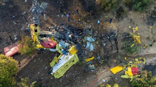 Rescuers operate at the site wher<em></em>e a firefighting plane crashed after a water drop as a wildfire burns in Platanistos on the island of Evia, Greece, July 25, 2023.