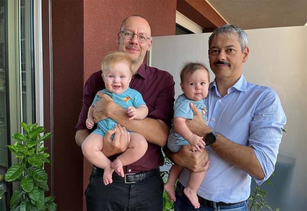 Maurizio (L) holding Giorgio and Mauro (R) holding Luisa