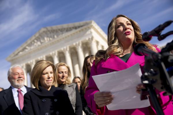 FILE - Lorie Smith, a Christian graphic artist and website designer in Colorado, right, accompanied by her lawyer, Kristen Waggo<em></em>ner of the Alliance Defending Freedom, second from left, speaks outside the Supreme Court in Washington, Monday, Dec. 5, 2022, after her case was heard before the Supreme Court. In a defeat for gay rights, the Supreme Court's co<em></em>nservative majority ruled Friday, June 30, 2023, Smith who wants to design wedding websites can refuse to work with same-sex couples. (AP Photo/Andrew Harnik, File)