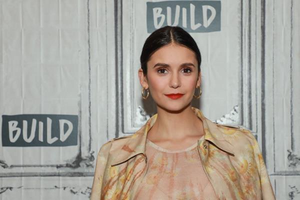 nina dobrev in pink dress on red carpet