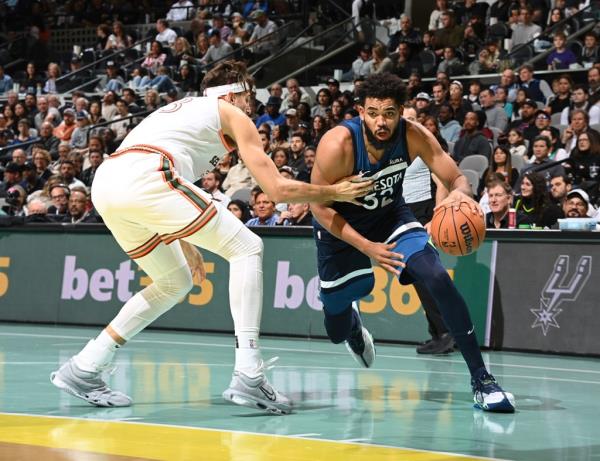 Karl-Anthony Towns #32 of the Minnesota Timberwolves drives to the basket during the game against the San Anto<em></em>nio Spurs during the In-Season Tournament on November 10, 2023 at the Frost Bank Center in San Antonio, Texas. 