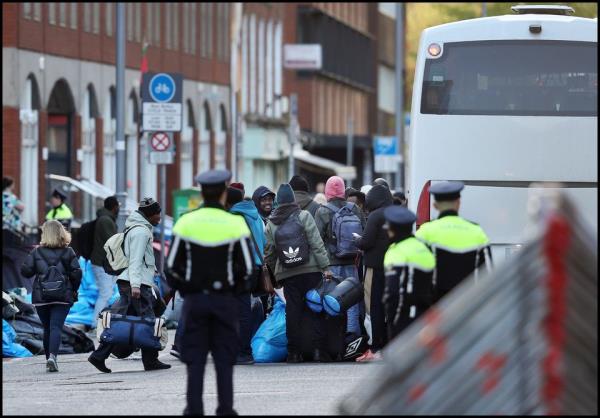 Asylum seekers get on a coach in Dublin's Mount Street