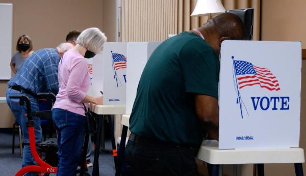 Voter mark their ballots during the primary election and abortion referendum at a Wyandotte County polling station in Kansas City, Kansas, U.S. August 2, 2022.