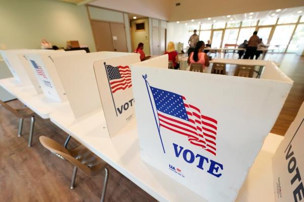 Empty poll kiosks await voters at the Mississippi Second Co<em></em>ngressional District Primary election precinct June 7, 2022, in Jackson, Miss.