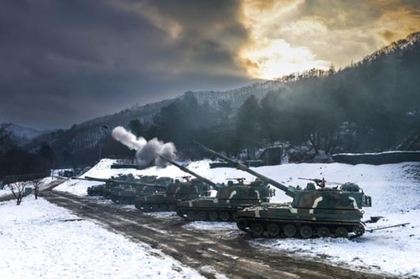 This photo, provided by the Army on Jan. 2, 2024, shows K9 self-propelled howitzers of the 2nd Artillery Brigade taking part in a live-fire exercise at a training ground in Hwacheon County, 89 kilometers northeast of Seoul. (PHOTO NOT FOR SALE) (Yonhap)