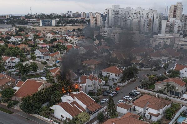 Smoke rises after a rocket fired from the Gaza Strip hit a house in southern Israel last Saturday. Photo: AP/Tsafrir Abayov