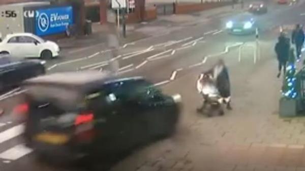 mum pushing child in buggy miraculously escapes crash after car flips