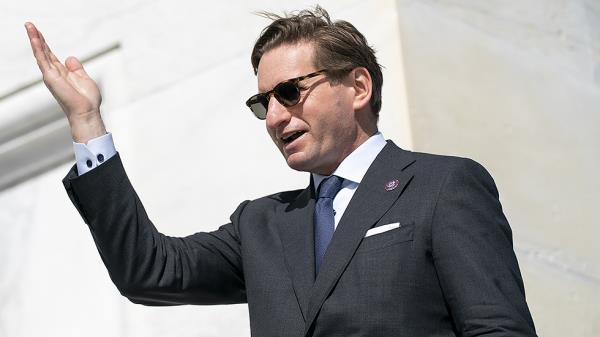 Rep. Dean Phillips (D-Minn.) jokingly works on his pageant wave as he leaves the Capitol following the final vote of the week on Thursday, March 3, 2022.