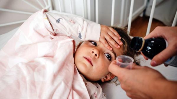 Toddler is given cough syrup.