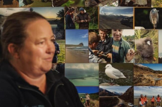 Elizabeth Bell at her Blenheim HQ by a mo<em></em>ntage of photos showing the work of Wildlife Management International