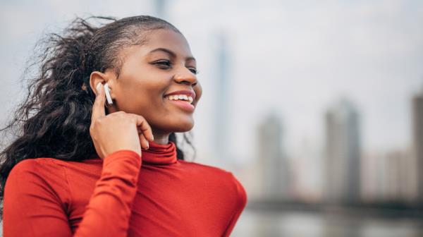 woman with AirPods smiling