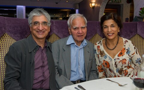 hancellor Rishi Sunak's parents Yashvir (left) and Usha Sunak, with Raghu Berry visiting Kuti's in 2016.