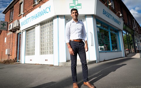 Former Chancellor to the Exchequer and Co<em></em>nservative leadership co<em></em>ntender Rishi Sunak poses during a visit to his family's old business, Bassett Pharmacy as part of his campaign to be leader of the Co<em></em>nservative Party and the next prime minister on August 24, 2022