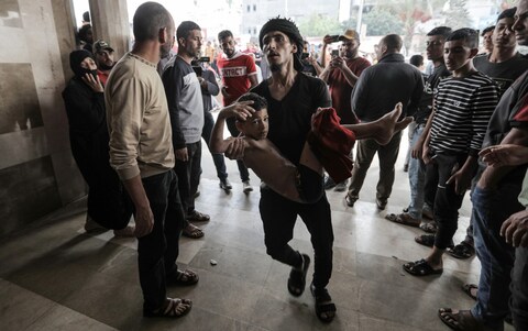 Palestinians injured in Israeli raids arrive at Nasser Medical Hospital on November 13, 2023 in Khan Yunis, Gaza.