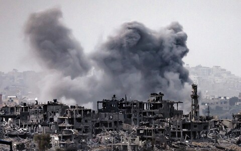 This picture taken on November 12, 2023 from a position along the border with the Gaza Strip in southern Israel shows a smoke plume erupting during Israeli bombardment on the Palestinian enclave amid o<em></em>ngoing battles.