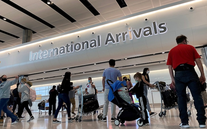 Passengers from internatio<em></em>nal flights arrive at Heathrow Airport