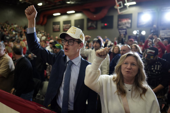 Supporters cheer before the arrival of former president Do<em></em>nald Trump at a rally in Iowa.