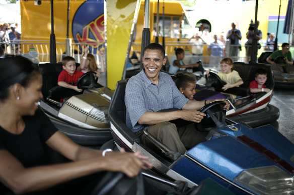 Barack Obama bumps Michelle Obama at the 2007 Iowa State Fair shortly before his win in the state that kicked off his successful presidential bid.