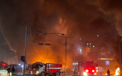 Firefighters work at the scene of an explosion from a vehicle crash in Ulaanbaatar, the capital of Mo<em></em>ngolia on January 24, 2024.