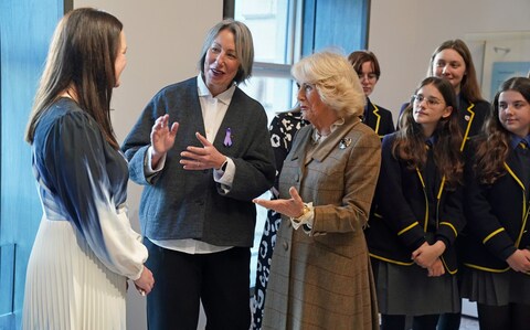 Her Majesty, seen chatting to campaigners, has long highlighted the threat of domestic abuse and violence against women