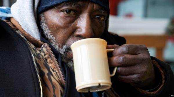 Pierre Bouyer wears a coat he got at Blanchet House, which offers meals and clothing to people experiencing homelessness, on Jan. 11, 2024, in Portland, Ore. 