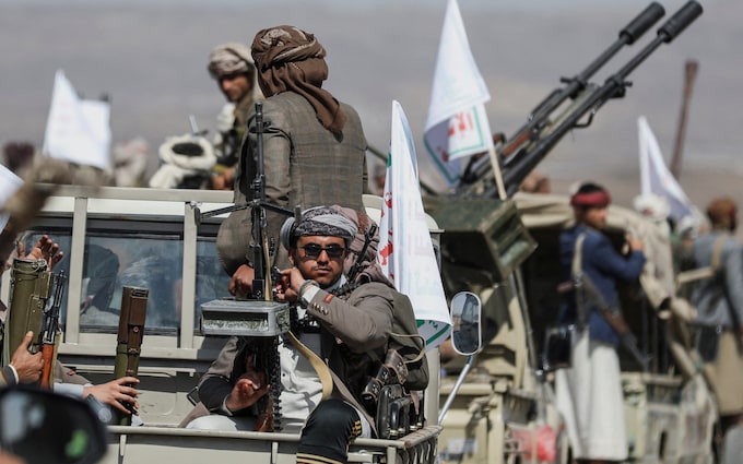 Houthi tribesmen gather to show defiance after US and UK air strikes on Houthi positions near Sana'a