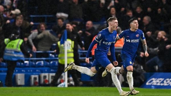 Cole Palmer celebrates Chelsea's fourth and winning goal in the 11th minute of injury-time at Stamford Bridge