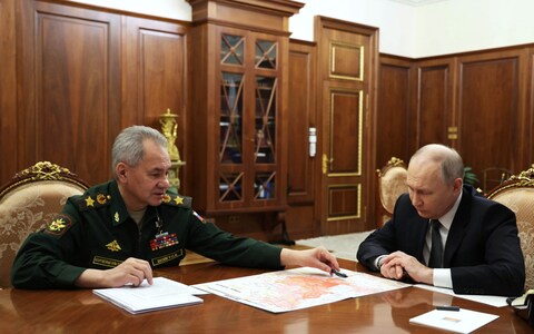 Vladimir Putin meets with Sergei Shoigu, his defence minister at the Kremlin in Moscow to discuss the alleged capture