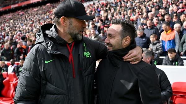 Jurgen Klopp (L) with Brighton boss Roberto De Zerbi, who has been tipped to replace manager boss