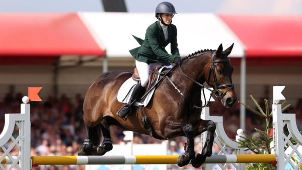 Lucy Latta riding RCA Patron Saint on her way to second place during the jumping test