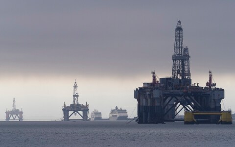 Oil rigs moored in the shallow waters of the Cromarty Firth in Scotland