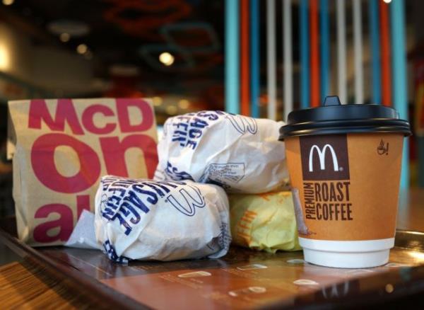 McDo<em></em>nalds bagel sandwiches and coffee on a table