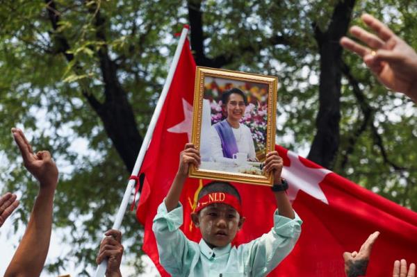 A protester holds up a portrait of Aung San Suu Kyi during a demo<em></em>nstration to mark the third anniversary of Myanmar’s 2021 military coup, outside of the United Nations office in Bangkok, Thailand, February 1, 2024.