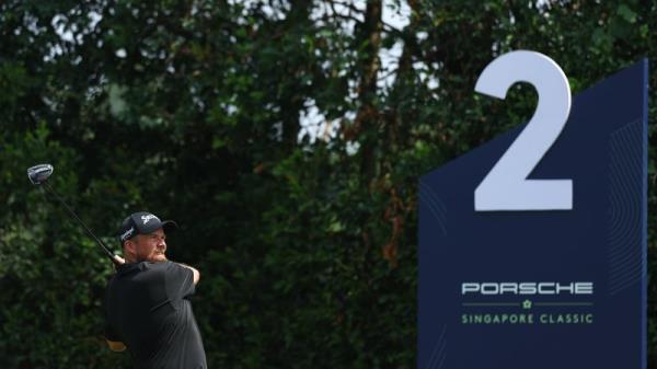 Shane Lowry tees off on the second hole in Singapore