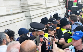 At least a dozen officers in high-vis uniforms approached the crowd