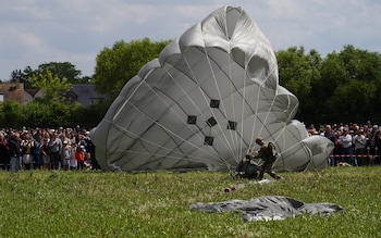 Parachute jumpers land in Normandy