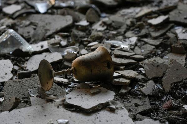 Burnt Kiddush cup in kibbutz wreckage