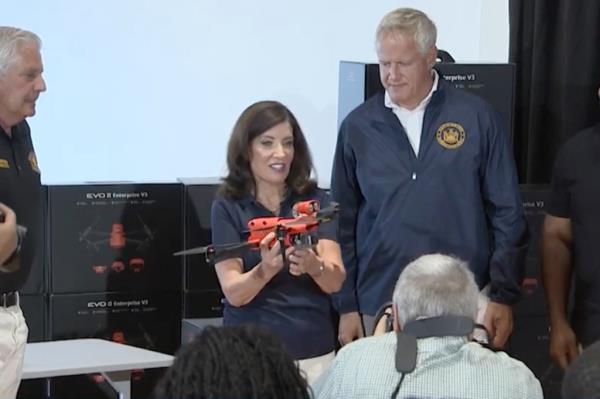 New York Governor Kathy Hochul, 64, holds up one of the 60 dro<em></em>nes that will be deployed to Long Island, New York City, and Westchester beaches as part of the new $1 million program. 