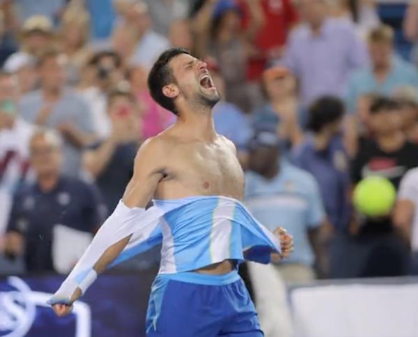 Novak Djokovic rips his shirt after winning the Cincinnati Open.